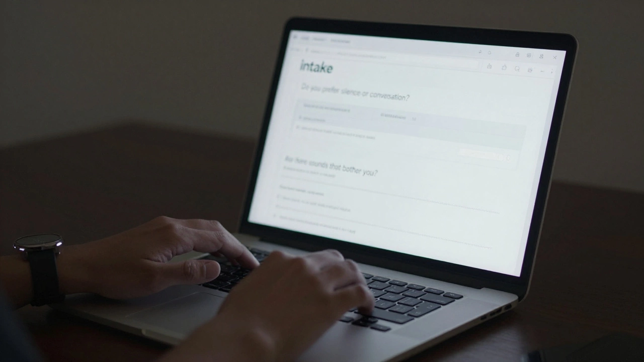 Hands typing on a laptop showing a written client intake form, with a hydration reminder visible on screen.